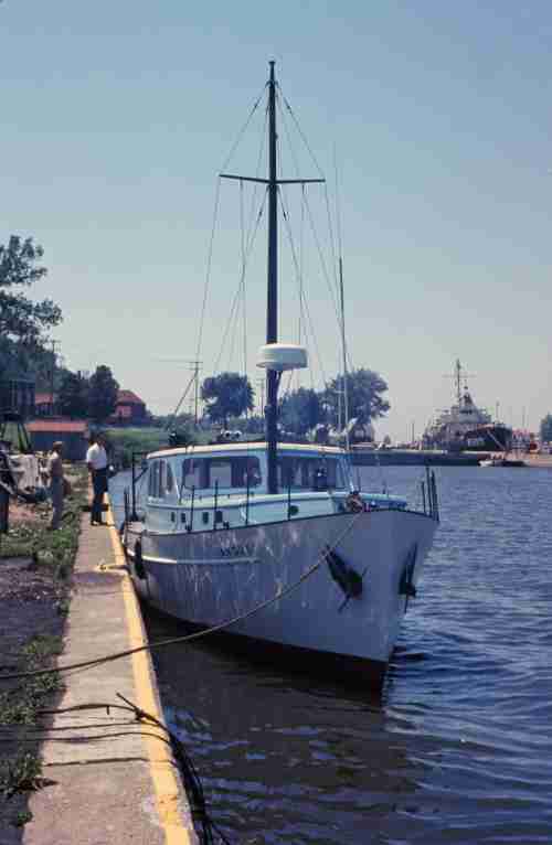 An old photo of the original angus boat docked in the water